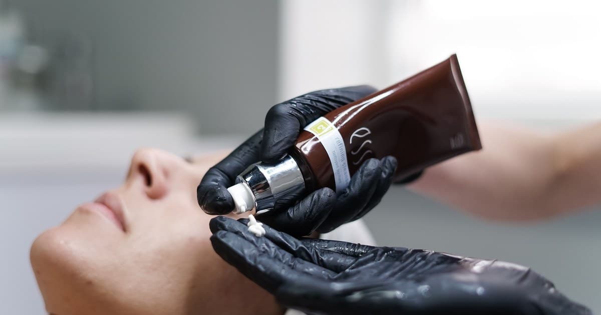 Skin care professional preparing a hydrating facial treatment