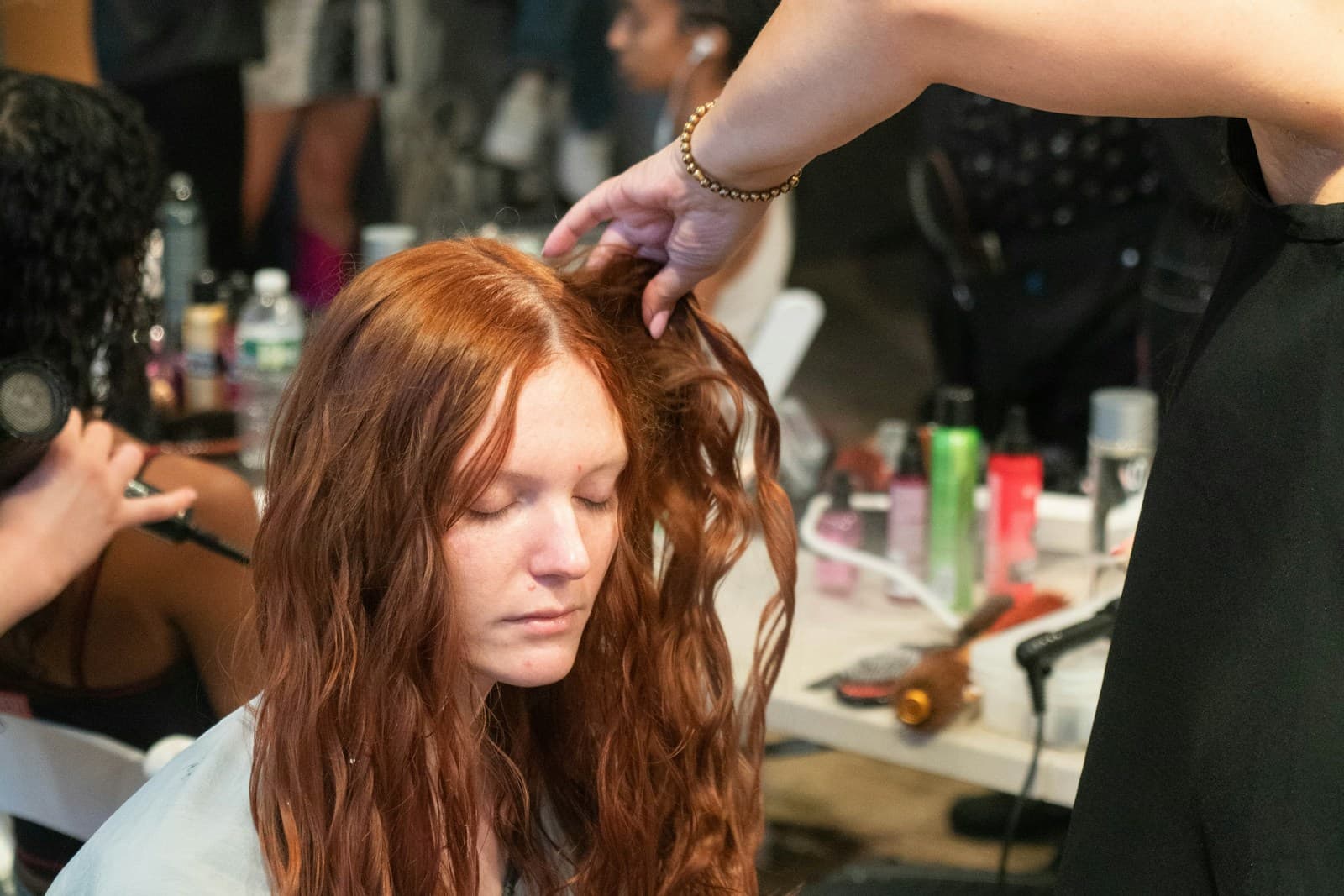 Illustrative Unsplash stock photo of a hairstylist working with a client's hair; not a keratin service or Mosaic client or result