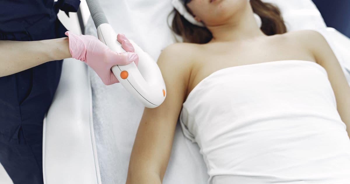 Laser hair removal treatment performed with protective eyewear in a clinic